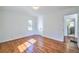 Clean bedroom with hardwood floors and fresh paint boasts a light and bright space at 3406 Jackson Dr, Decatur, GA 30032