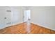 Bedroom with hardwood floors, white walls, and closet space at 3406 Jackson Dr, Decatur, GA 30032