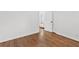 Clean bedroom displays hardwood floors, white trim and paint and an open doorway at 3406 Jackson Dr, Decatur, GA 30032