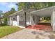 Charming single-story home featuring a convenient covered parking area and well-manicured lawn at 3406 Jackson Dr, Decatur, GA 30032