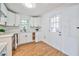 Bright kitchen featuring white cabinets, sleek countertops, and modern fixtures at 3406 Jackson Dr, Decatur, GA 30032