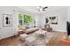 Cozy living room with stylish furniture, large windows, and hardwood floors at 3406 Jackson Dr, Decatur, GA 30032