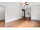 Bright, spacious living room with hardwood floors, a ceiling fan, and ample natural light at 3406 Jackson Dr, Decatur, GA 30032