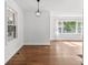 Open-concept living room with hardwood floors, large windows, and ample natural light at 3406 Jackson Dr, Decatur, GA 30032