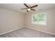 Bright bedroom features a ceiling fan and a window bringing in natural light at 429 Landers Dr, Mableton, GA 30126