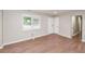 Bright living room featuring hardwood floors, fresh paint, and sunlit windows with mini blinds at 429 Landers Dr, Mableton, GA 30126