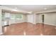 Open-concept living space with wood floors, updated kitchen, stainless steel appliances, and natural light at 429 Landers Dr, Mableton, GA 30126