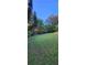 A large backyard featuring lush greenery and privacy trees; great for outdoor activities at 570 Eldridge Dr, Suwanee, GA 30024