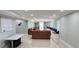 Spacious basement featuring seating, a desk, and tile floors, great for entertaining guests at 570 Eldridge Dr, Suwanee, GA 30024