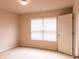 A simple bedroom with neutral carpet and a white door at 570 Eldridge Dr, Suwanee, GA 30024