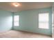 A bedroom with blue walls, carpet, and natural light from the windows at 570 Eldridge Dr, Suwanee, GA 30024