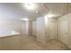 Upstairs hallway with neutral carpet, white trim, and multiple doors at 570 Eldridge Dr, Suwanee, GA 30024