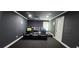 Entertainment room with tiered seating and a large projector screen for movie nights at 570 Eldridge Dr, Suwanee, GA 30024