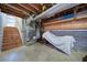 Unfinished basement featuring exposed ceiling, concrete floor, and stairs to the main level at 619 Stoney Creek Rd, Woodstock, GA 30188