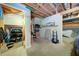 Spacious basement with open ceiling, storage, and access to garage with truck at 619 Stoney Creek Rd, Woodstock, GA 30188
