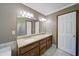 Bathroom features dual sinks, granite countertops, and a large mirror at 619 Stoney Creek Rd, Woodstock, GA 30188