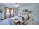 Bright bedroom features a ceiling fan, neutral color palette, and natural light, creating a cozy and inviting space at 619 Stoney Creek Rd, Woodstock, GA 30188
