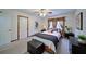 A cozy bedroom with ceiling fan, modern decor, and lots of natural light creates a warm and inviting atmosphere at 619 Stoney Creek Rd, Woodstock, GA 30188
