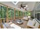 Large outdoor deck offering a relaxing space with a great view of the surrounding trees at 619 Stoney Creek Rd, Woodstock, GA 30188