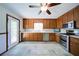 Charming kitchen featuring wooden cabinets, stainless steel appliances, and ample counter space at 619 Stoney Creek Rd, Woodstock, GA 30188