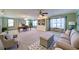 Spacious living room with multiple windows, built-in shelves, and comfortable seating at 619 Stoney Creek Rd, Woodstock, GA 30188