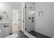Modern bathroom featuring a glass shower, tile floors, and quartz countertop sink at 1749 Patriots Nw Way, Kennesaw, GA 30152