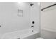 Stylish bathroom showcasing a tiled shower and tub combination with modern fixtures at 1749 Patriots Nw Way, Kennesaw, GA 30152