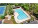 Aerial view of the community pool with ample seating and is surrounded by mature trees at 1749 Patriots Nw Way, Kennesaw, GA 30152