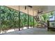 The covered patio boasts ceiling fans, stairs to the upper level, and a great view of the backyard at 1749 Patriots Nw Way, Kennesaw, GA 30152