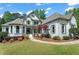 Charming painted brick home with well-manicured lawn and mature landscaping at 1749 Patriots Nw Way, Kennesaw, GA 30152