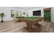 This spacious game room features a pool table, a dart board, and comfortable seating for Gathering and friends at 1749 Patriots Nw Way, Kennesaw, GA 30152