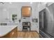 Modern kitchen with stainless steel appliances, white cabinets, and an expansive countertop at 1749 Patriots Nw Way, Kennesaw, GA 30152