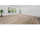 Large living room with hardwood floors and lots of natural light at 1749 Patriots Nw Way, Kennesaw, GA 30152