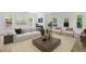 Bright and inviting living room with neutral tones, large windows, and stylish furnishings for comfortable living at 1749 Patriots Nw Way, Kennesaw, GA 30152