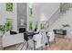 Bright living room boasts modern decor, a fireplace, and soaring ceilings with lots of natural light at 1749 Patriots Nw Way, Kennesaw, GA 30152