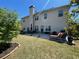 Backyard featuring patio with furniture, grill and large grassy area at 2030 Hydrangea Ln, Austell, GA 30106