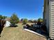 Backyard with patio and furniture and a large grassy area at 2030 Hydrangea Ln, Austell, GA 30106