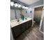 Bathroom featuring a double sink vanity and a view into the shower/toilet room at 2030 Hydrangea Ln, Austell, GA 30106