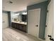 Large bathroom with double vanity and a door to an adjacent room at 2030 Hydrangea Ln, Austell, GA 30106