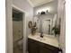 Bathroom view featuring a vanity with a view to the shower/tub combo with gray design at 2030 Hydrangea Ln, Austell, GA 30106