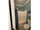 Clean bathroom features a toilet and shower/tub combo and neutral design elements at 2030 Hydrangea Ln, Austell, GA 30106