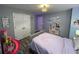 Bright bedroom featuring neutral walls, plush bedding, and ample closet space at 2030 Hydrangea Ln, Austell, GA 30106