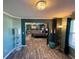 Spacious bedroom features stylish wood floors, neutral walls and large adjoining room at 2030 Hydrangea Ln, Austell, GA 30106