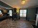Spacious bedroom features stylish wood floors, neutral walls and a view from the bright window at 2030 Hydrangea Ln, Austell, GA 30106