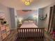 Cozy bedroom with unique wall art, warm lighting, and hardwood floors at 2030 Hydrangea Ln, Austell, GA 30106