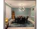 Lovely dining room with a modern chandelier and seating for six, perfect for Gathering dinners at 2030 Hydrangea Ln, Austell, GA 30106