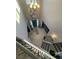 High angle shot of foyer with chandelier, teal front door, and wood flooring at 2030 Hydrangea Ln, Austell, GA 30106