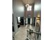 Bright and airy foyer featuring high ceilings, a modern chandelier, and a staircase at 2030 Hydrangea Ln, Austell, GA 30106