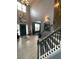 Inviting entryway featuring high ceilings, a staircase and modern lighting fixtures at 2030 Hydrangea Ln, Austell, GA 30106