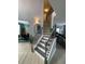 Inviting entryway featuring high ceilings, a staircase and modern lighting fixtures at 2030 Hydrangea Ln, Austell, GA 30106